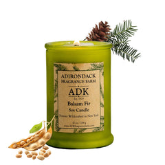 Adirondack Fragrance Farm ADK Balsam Fir Candle jar glows for cozy ambiance.