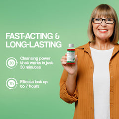 Advanced Detox Solutions Immediate Cleanser ready to use bottle beside a glass of water for hydration.