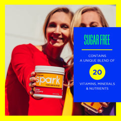 AdvoCare Spark scoop dispensing a measured serving for easy mixing.