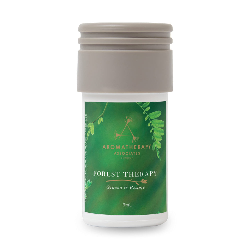 AERA Mini Forest Therapy bottle releasing pink pepper, cypress, ho wood for a calming atmosphere