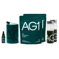 AG1 greens powder bottle shows gluten-free vegan daily supplement for gut health support.