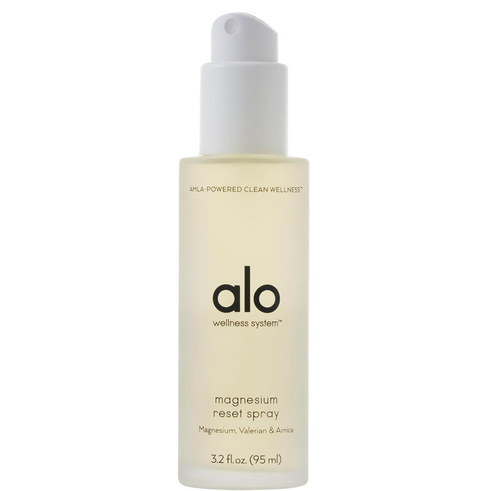 Alo Magnesium Oil Spray bottle on a nightstand, ready for nightly relaxation.