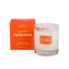 Aluminate Life Carnelian crystal infused candle glowing with warm optimism