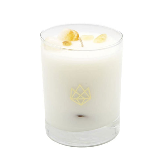 Aluminate Life Citrine crystal infused candle with citrine crystal visible in the wax, for creative ambiance.