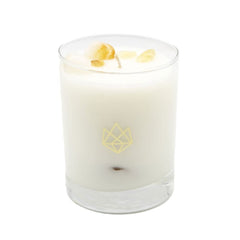 Aluminate Life Citrine crystal infused candle with citrine crystal visible in the wax, for creative ambiance.