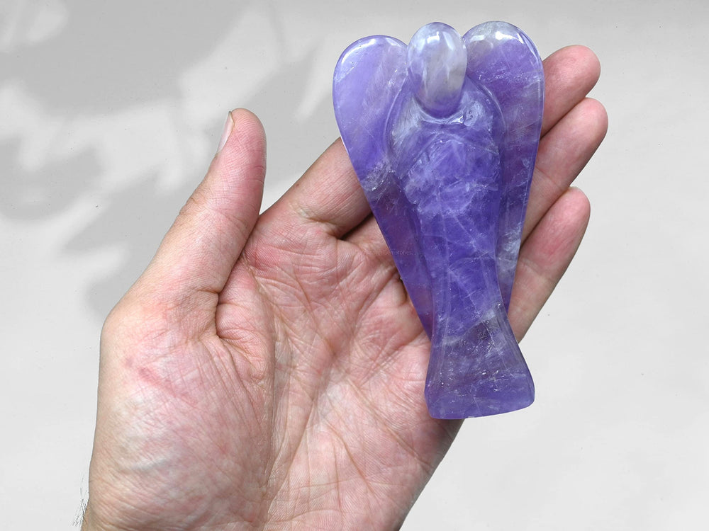 A 4-inch Amazing Gemstone Amethyst Angel stands securely on any surface.