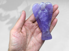 A 4-inch Amazing Gemstone Amethyst Angel stands securely on any surface.