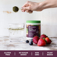Amazing Grass Sweet Berry Powder being poured into a glass for a quick daily boost