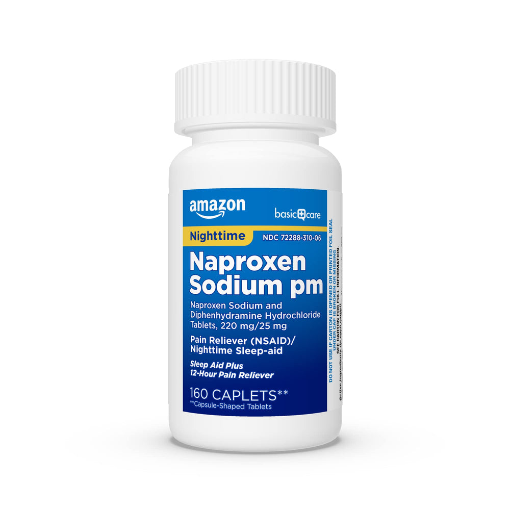 Amazon Basic Care PM tablets beside nightstand for nightly routine