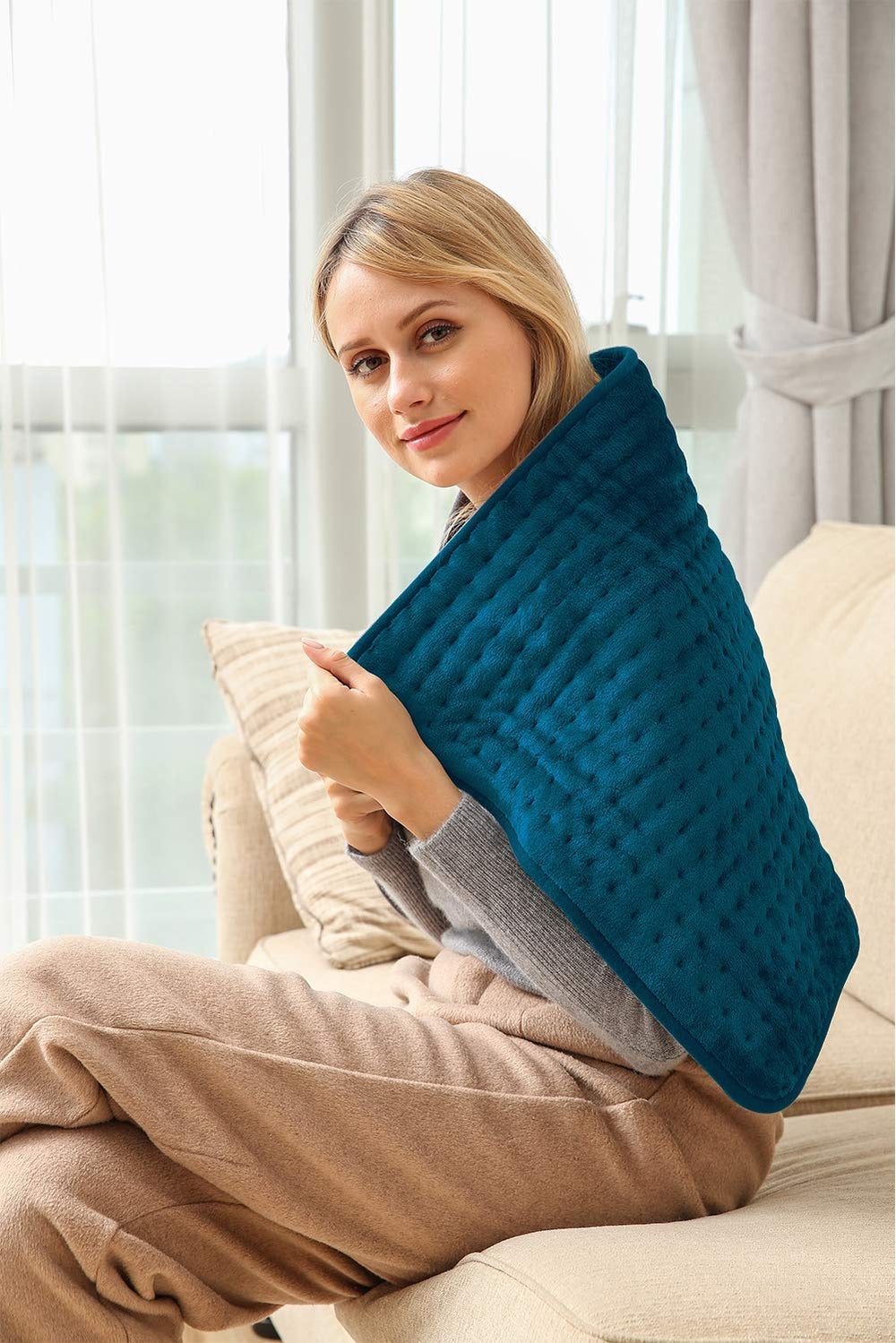 Ambershine dark teal heating pad arrives gift-ready for loved ones.