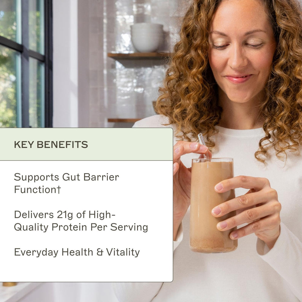 Amy Myers MD Paleo Protein Powder Mocha Latte shake in glass evokes creamy texture and aroma.