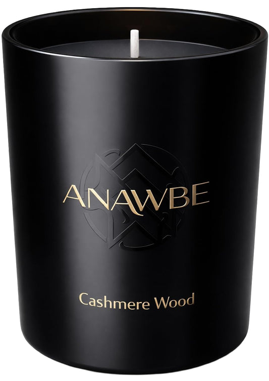 ANAWBE Cashmere Wood candle in a black vessel for elegant home ambiance.