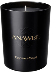 ANAWBE Cashmere Wood candle in a black vessel for elegant home ambiance.
