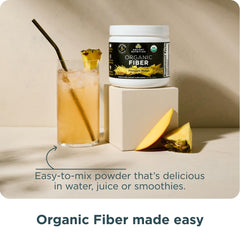 Ancient Nutrition Organic Fiber Powder pineapple mango powder dissolving in liquid.