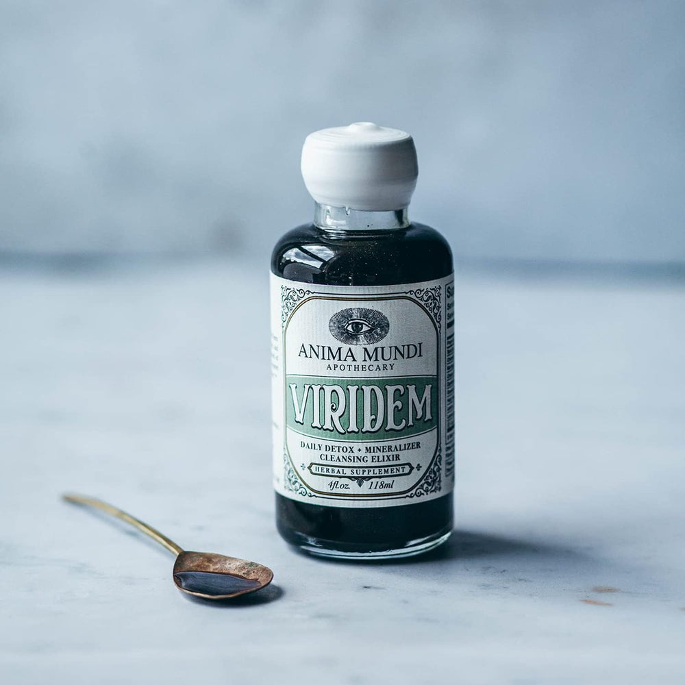 Anima Mundi Apothecary Viridem Greens Detox Elixir pour shows easy juice addition.