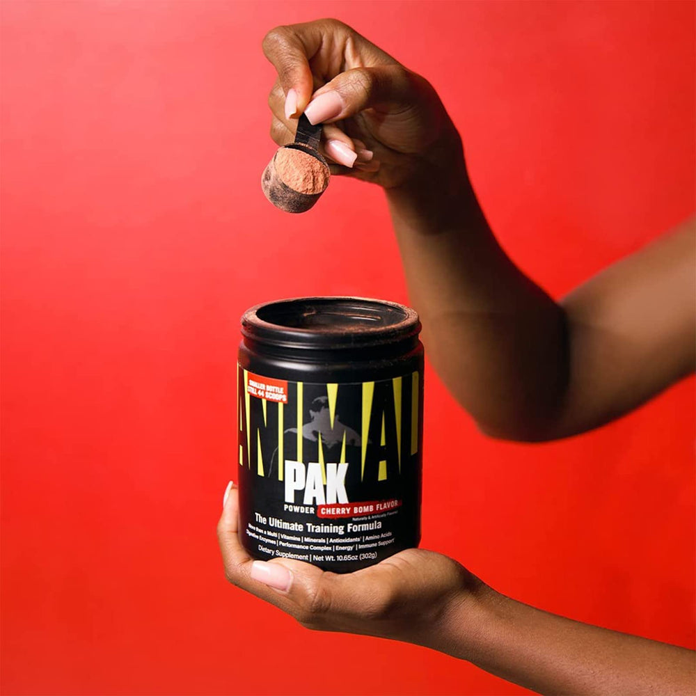Animal Pak glass serving shot highlighting orange flavor and mix