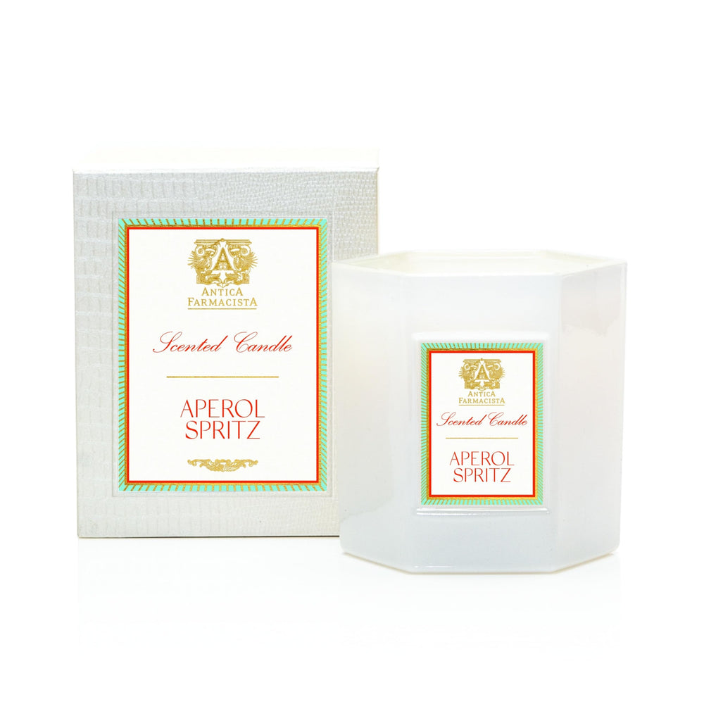 Antica Farmacista Aperol Spritz candle close-up highlights warm glow and citrus aroma.
