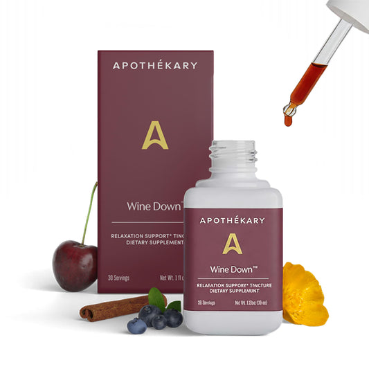 Apothekary Wine Down bottle pour showing alcohol-free sleep support in a calm setting.