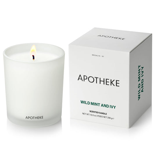APOTHEKE Signature Wild Mint Ivy candle in a glass vessel for a refined home scent.