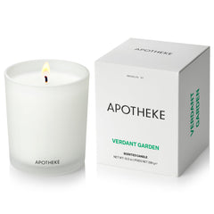 APOTHEKE Verdant Garden candle in a white glass jar elevates home ambiance.