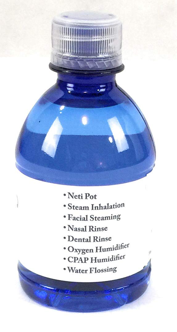 Pouring Aquapap water into a CPAP reservoir for clean use