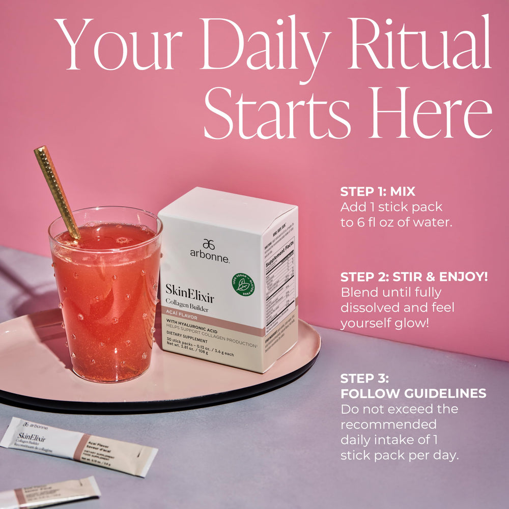 Arbonne SkinElixir being stirred in water for a refreshing acai boost.
