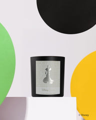 Aroma360 Pluto artwork candle design, showcasing Disney art and oudwood-leather-sandalwood notes for elegant spaces.