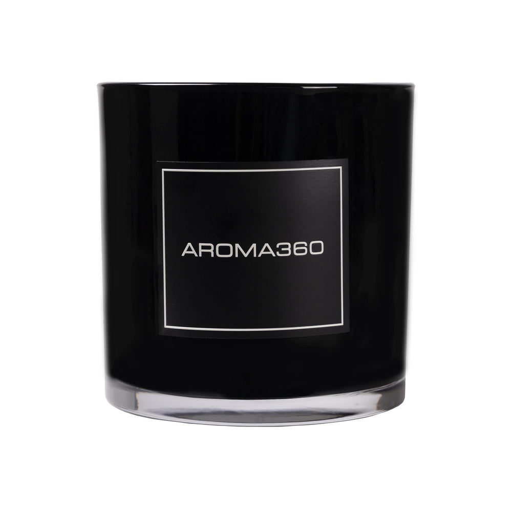Aroma360 Escapade candle with lemon and bergamot top notes for a refreshing ambiance.