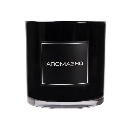 Aroma360 Escapade candle with lemon and bergamot top notes for a refreshing ambiance.