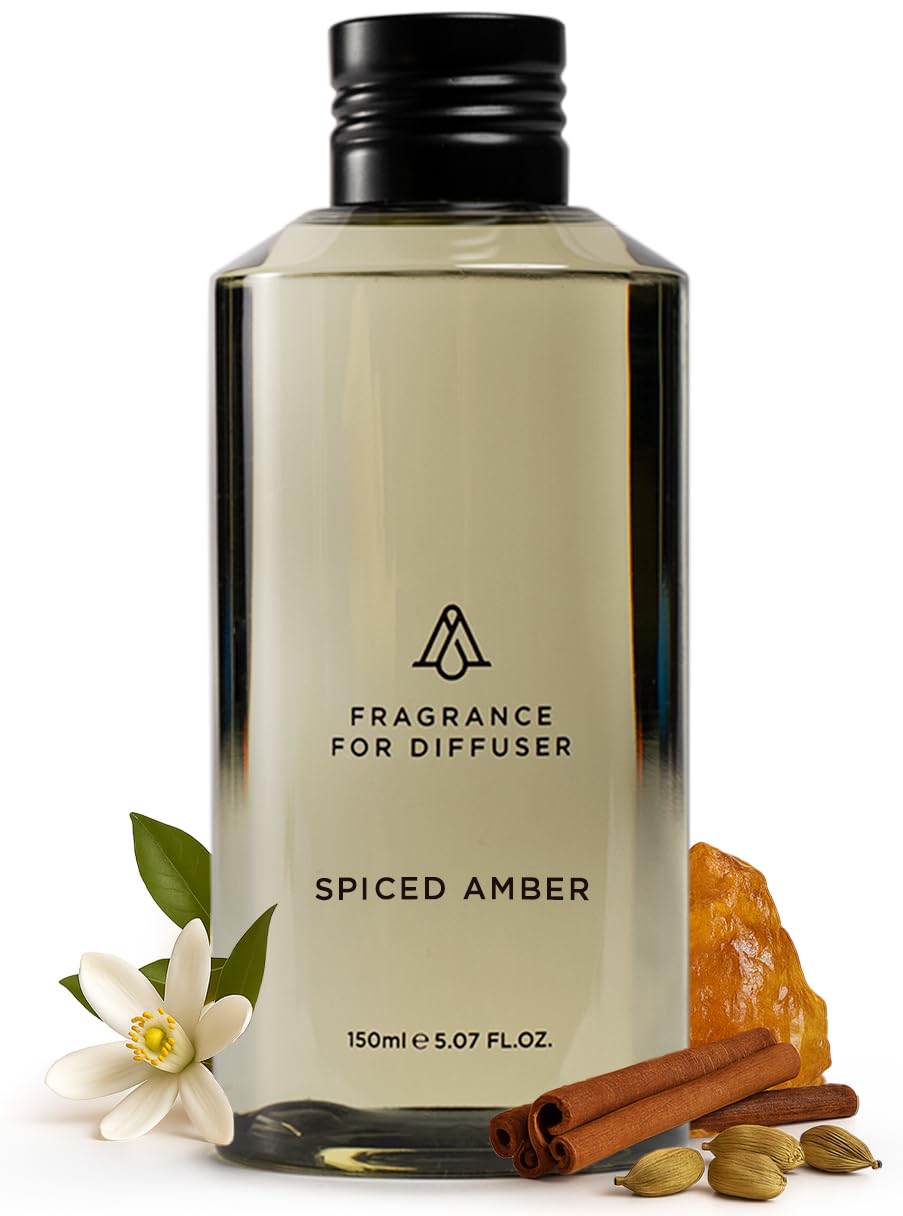 AROMAPLAN Spiced Amber fragrance oil bottle releasing a warm, inviting scent.