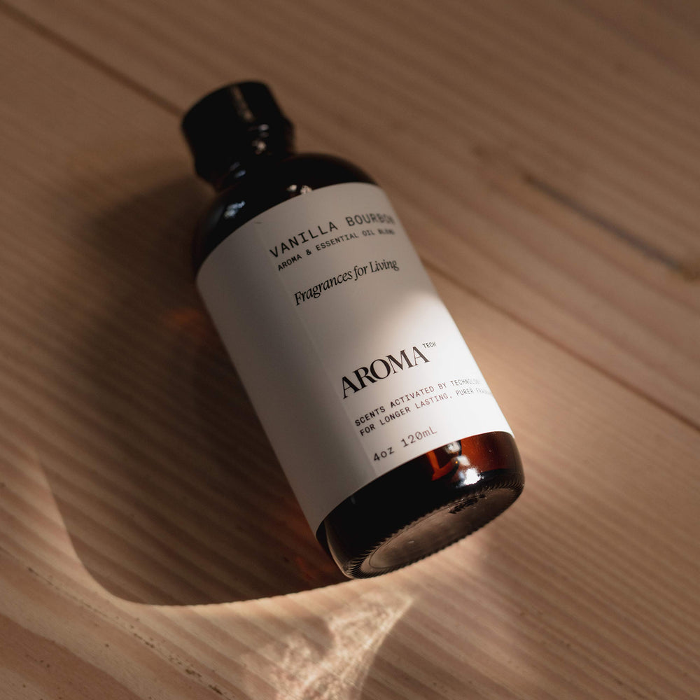 Amber glass bottle reflects cozy vanilla and oak notes for intimate spaces.