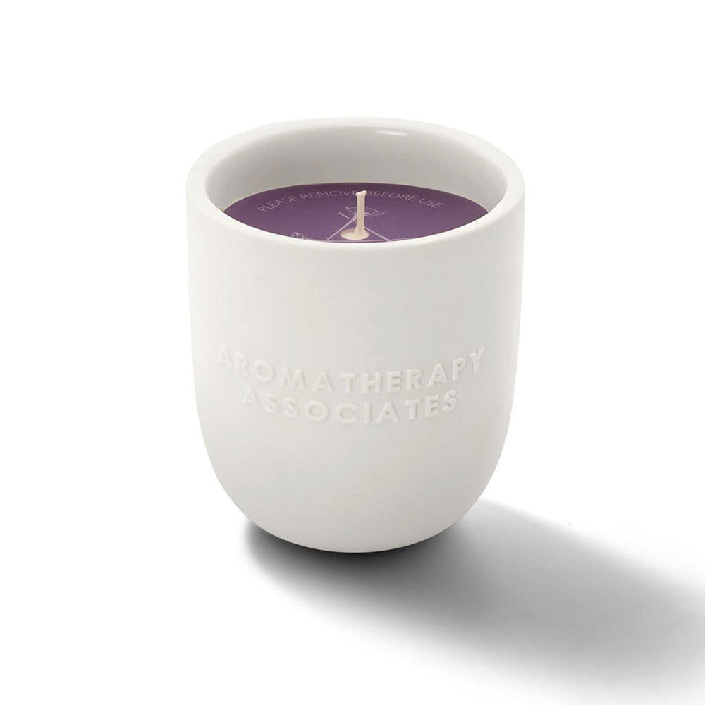 Aromatherapy Associates De-Stress Candle lit, releasing calming aromas for focused moments