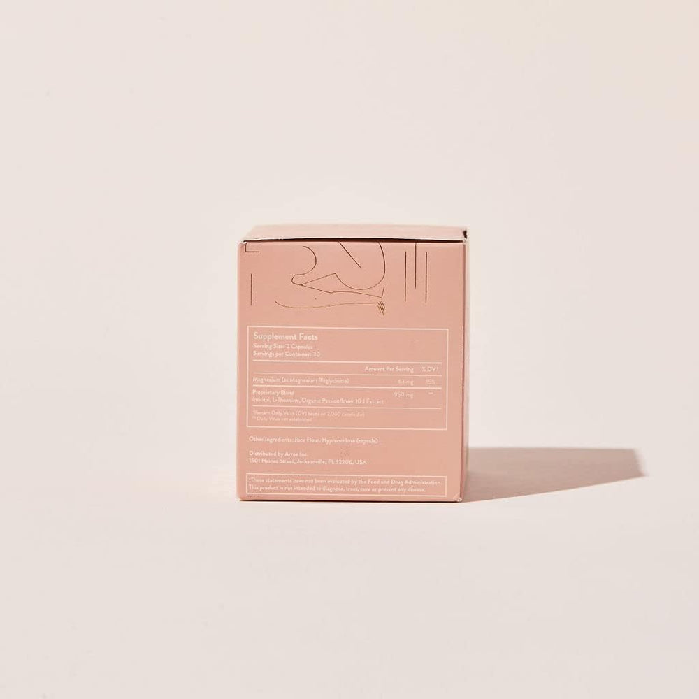 Arrae Calm capsules in hand illustrating convenient 1–3 capsule use.