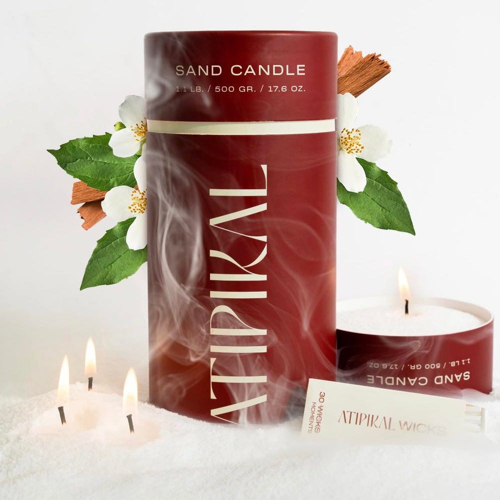 ATIPIKAL sand candle floats on water, perfect for decorative poolside ambiance.
