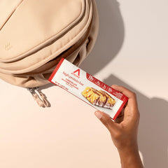 Atkins Chocolate Almond Caramel Bar in gym bag after workout for quick refuel