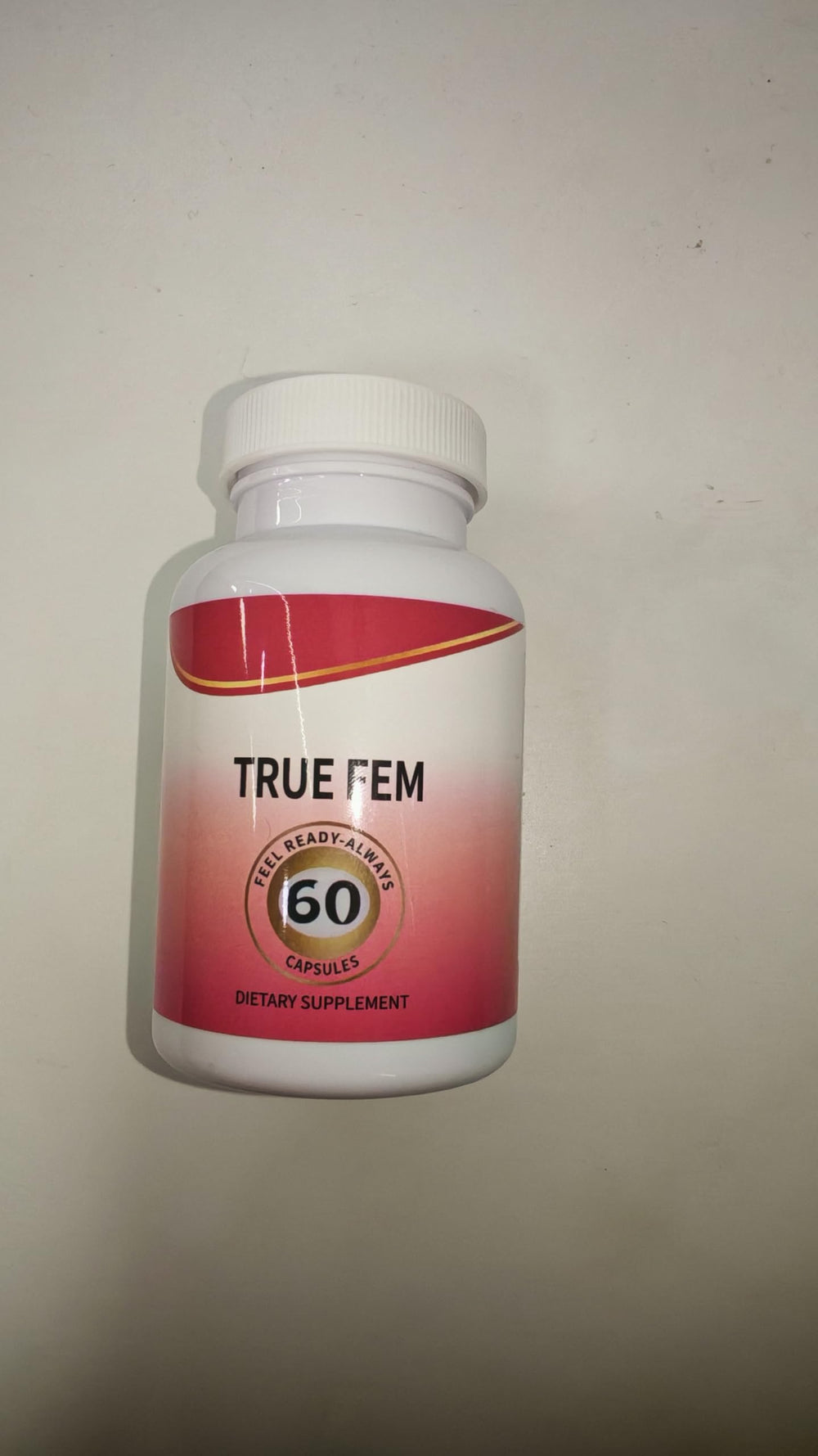 True Fem capsules beside the bottle highlighting natural plant-based formulation for balance.