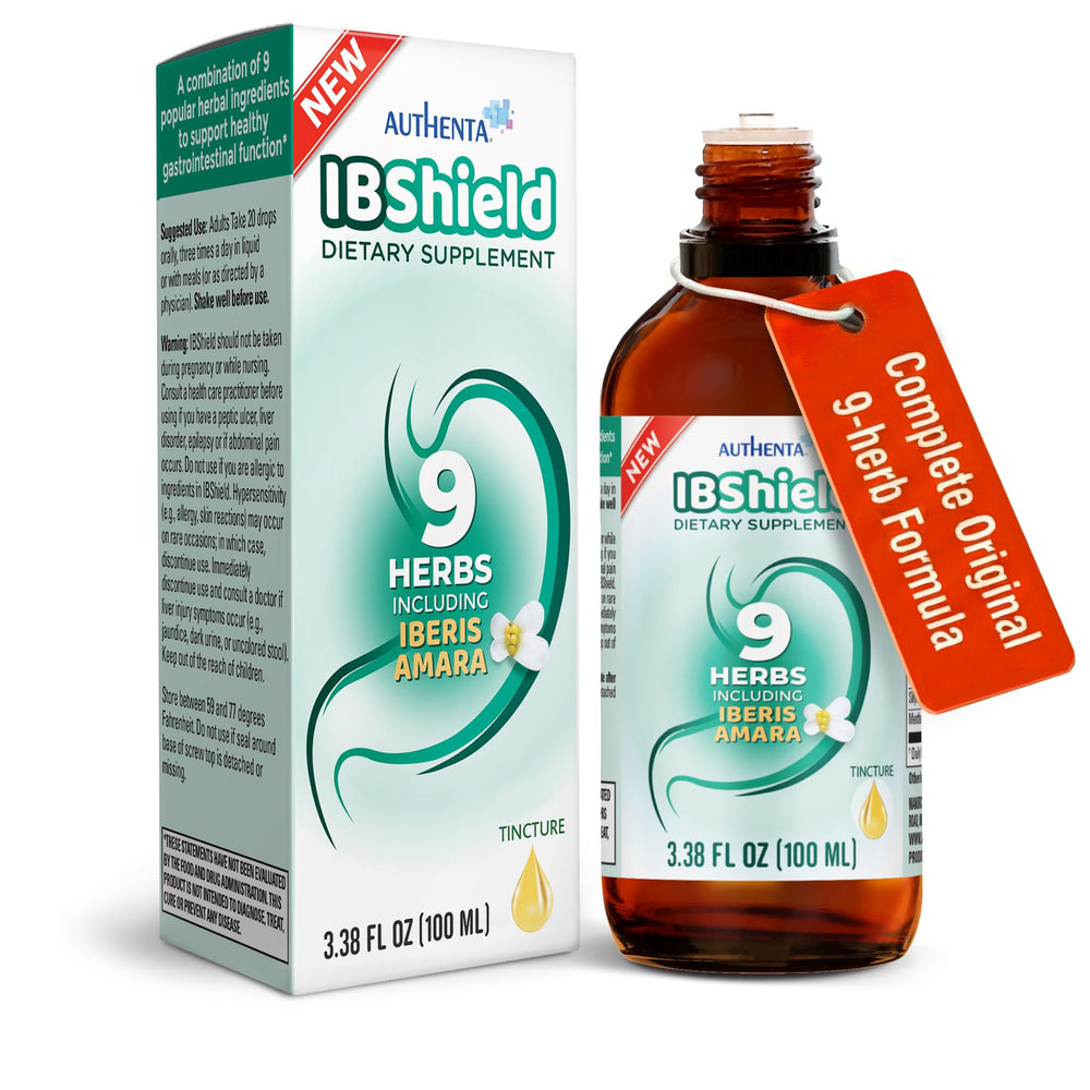 AUTHENTA IBShield tincture bottle on wood table for daily digestive support.