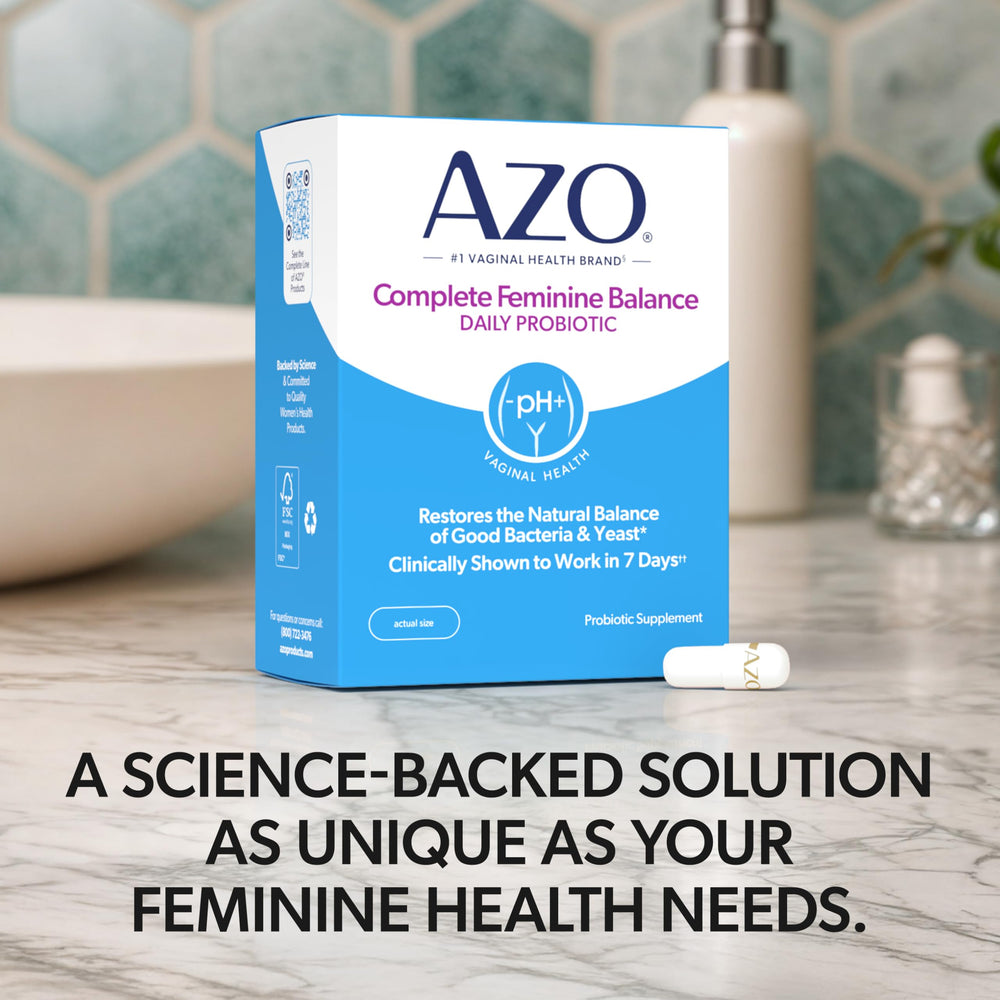AZO Complete Feminine Balance woman taking capsule during routine