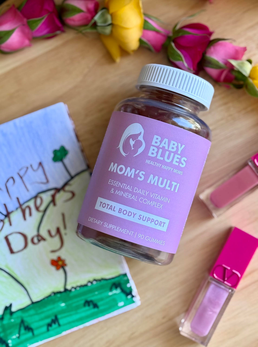 Baby Blues Mom's Multi Daily Gummies on table suggesting everyday hair, skin, and nails support.
