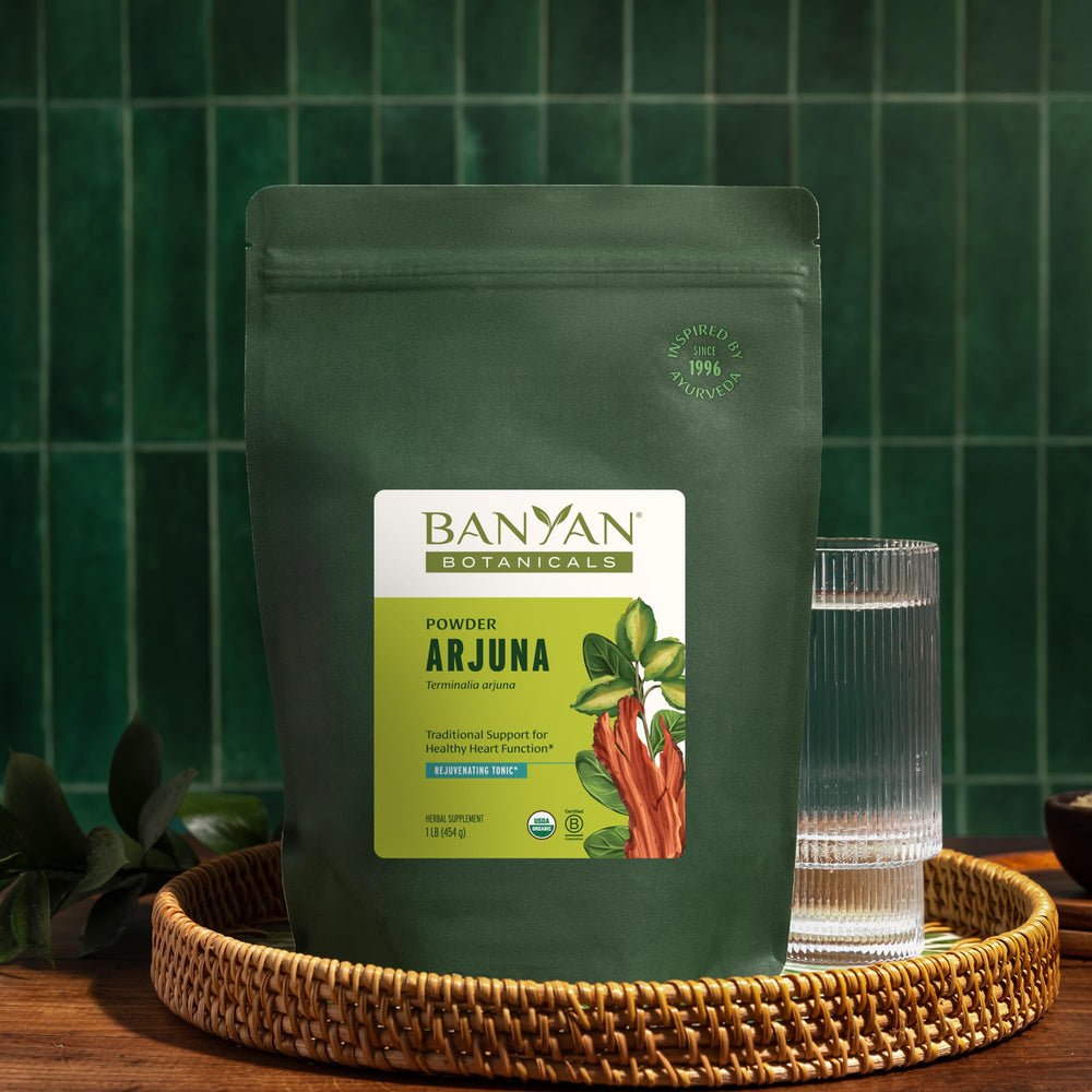 Warm tea brewed from Banyan Botanicals Arjuna Bark Powder offers a comforting ritual.