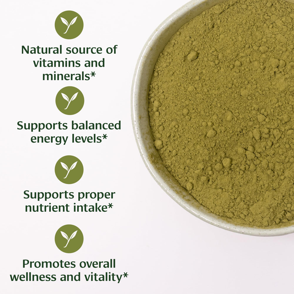 Banyan Botanicals Moringa powder pouring into a cup.