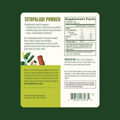 Banyan Botanicals Sitopaladi Powder scoop demonstrates convenient daily use for immune support.
