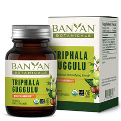 Banyan Botanicals Triphala Guggulu bottle on counter suggesting digestive support