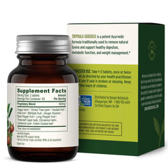 Retail display of Banyan Botanicals Triphala Guggulu indicating availability for users