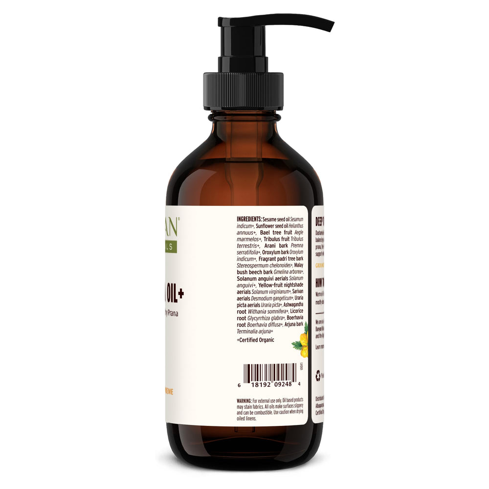Banyan Dashamula Oil+ organic herb blend displayed beside bottle.