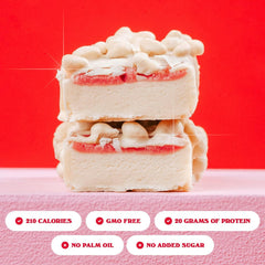 Barebells Wild Cherry bar split reveals creamy center with fruity cherry layers.
