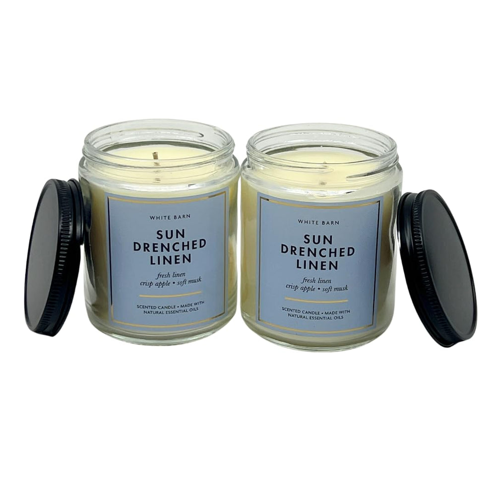 Bath and Body Works Sun Drenched Linen candle wick lighting creates warm ambiance.
