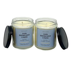 Bath and Body Works Sun Drenched Linen candle wick lighting creates warm ambiance.