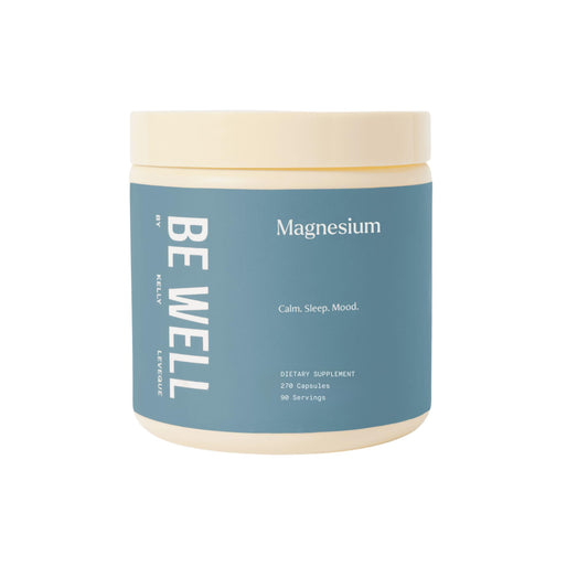 Be Well Magnesium bottle and capsules on a wooden surface for daily evening use.