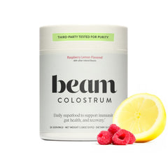 Beam Colostrum Powder bottle shows grass-fed formula for daily gut and immune support.
